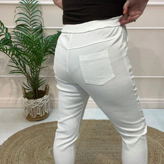 Marnie: Stretchy white magic trousers with rear pockets. 3 Sizes: 10-22