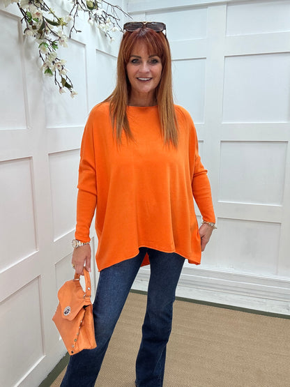 Maddie: Orange oversized long sleeve top. One size: 12-18