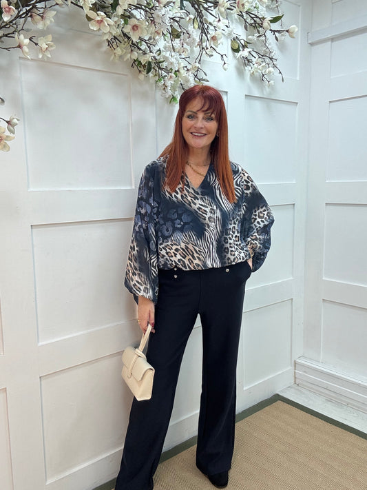 Vikki: Navy blue V neck animal print blouse. One size: 10-16