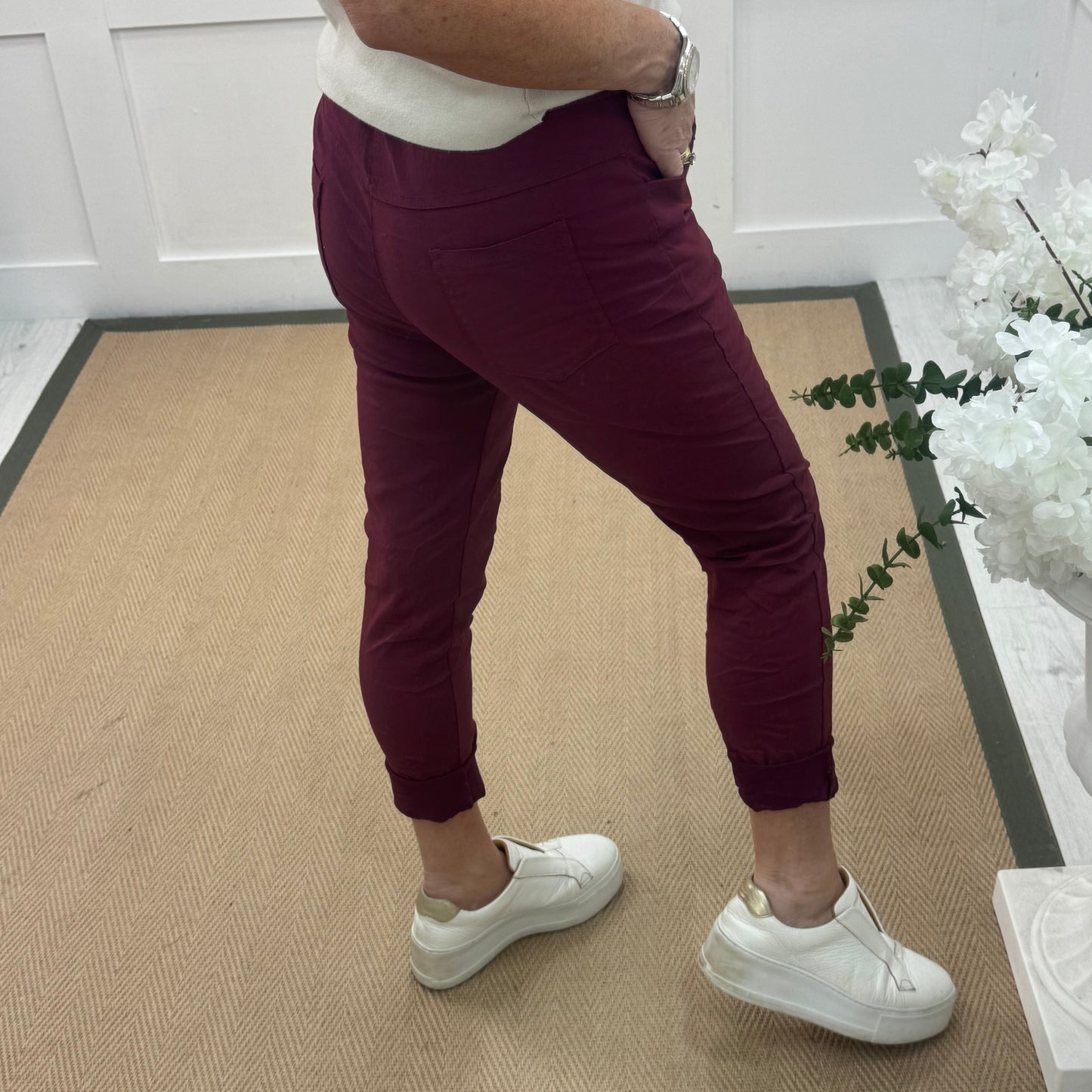 Marnie: Stretchy burgundy magic trousers with rear pockets. 3 Sizes: 10-22