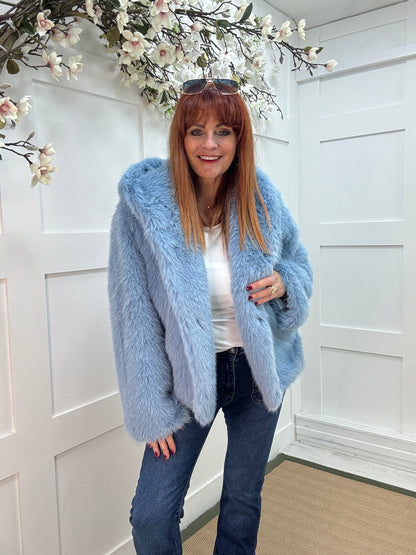 Foxy: Blue short faux fur hooded jacket. One size 12-16