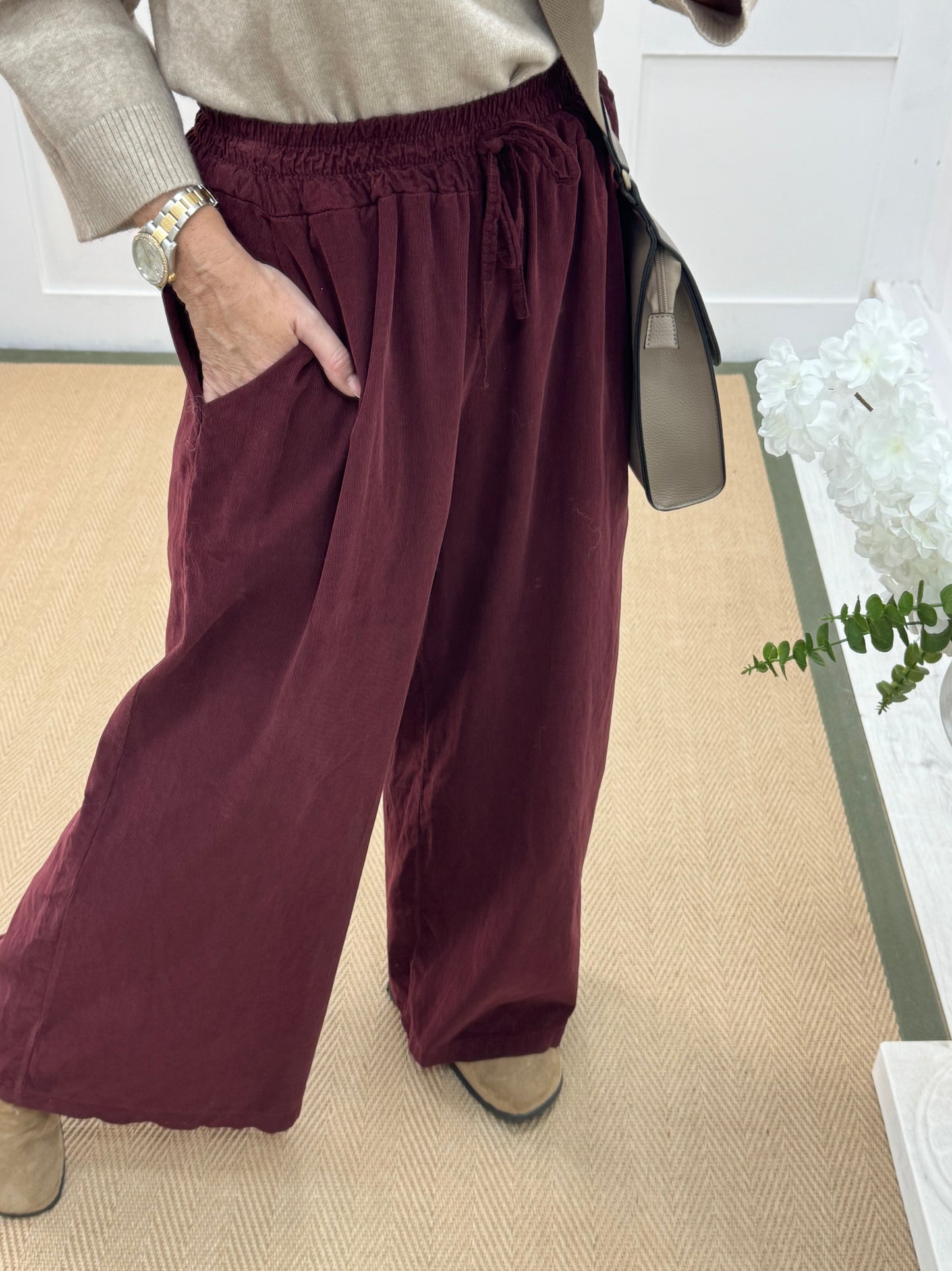 Lark: Burgundy needle cord wide trousers. One Size: 8-16