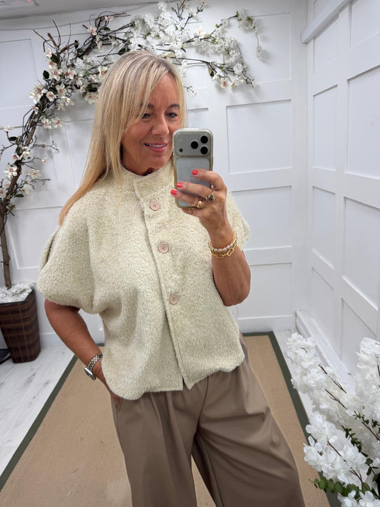 Connie: Cream short sleeve button front jacket. One size: 10-16