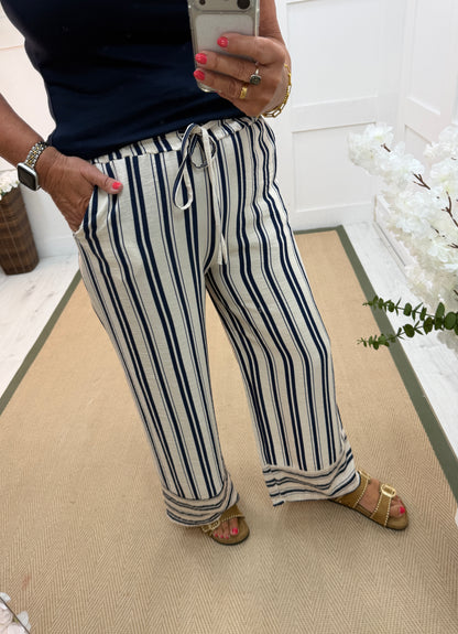 Stella: Cream & navy wide leg stripe trousers. One size: 10-16