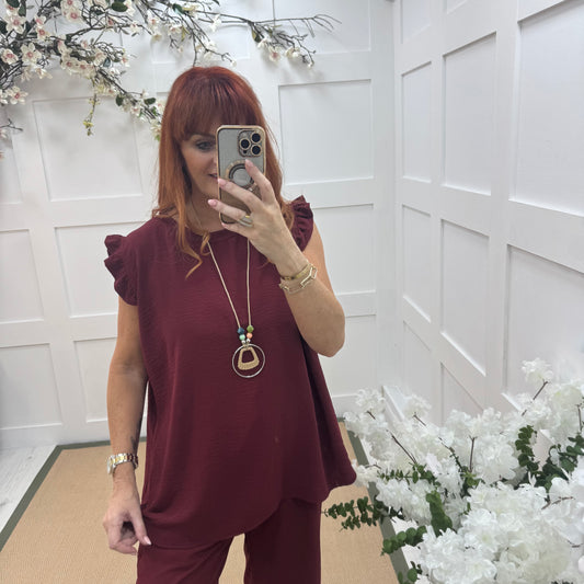 Ember: Burgundy frill sleeve top & pendant. One size: 14-20