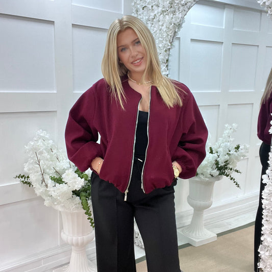 Jamiee: Burgundy soft feel bomber jacket. One size: 8-16