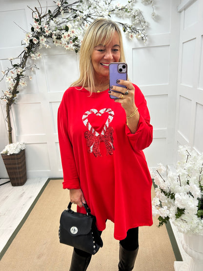Candice: Red candy cane oversized top. One size: 16-20
