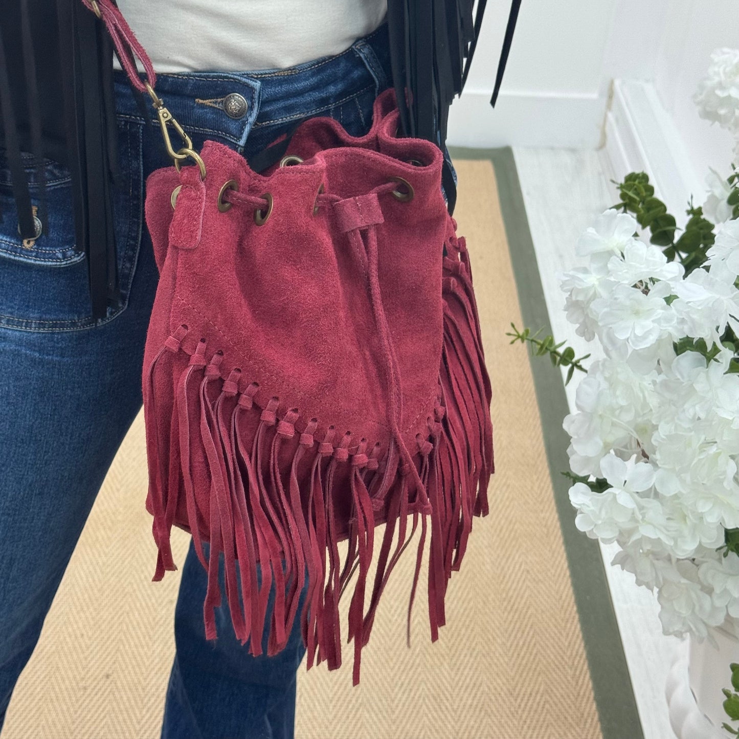 Athena: Burgundy real suede fringe cross body bag.