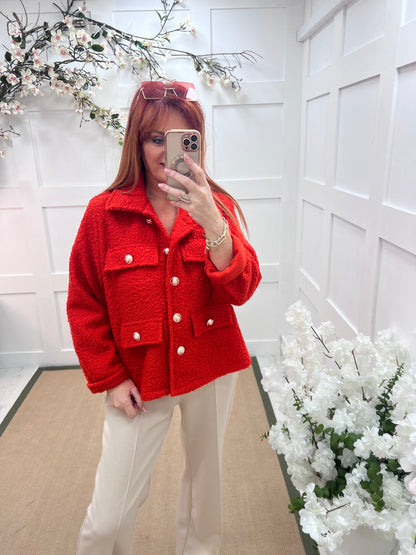 Bridget: Orange short boucle button jacket. One: 12-20