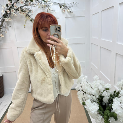 Paula: Cream short faux fur jacket . One size 10-16