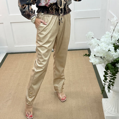 Tatum: Gold faux leather button trousers. One size: 14-18