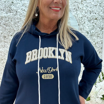 Madison: Navy Brooklyn logo hoodie. One size: 12-18