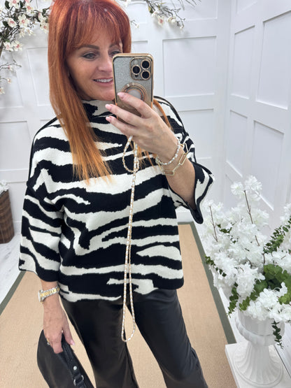 Luna: Zebra print knitted top. One size: 12-18