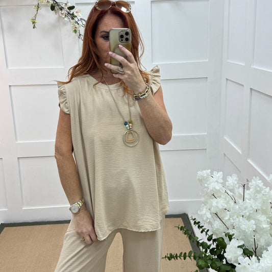 Ember: Cream frill sleeve top & pendant. One size: 14-20