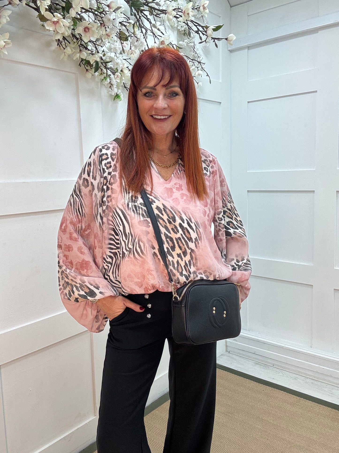 Vikki: Pink V neck animal print blouse. One size: 10-16