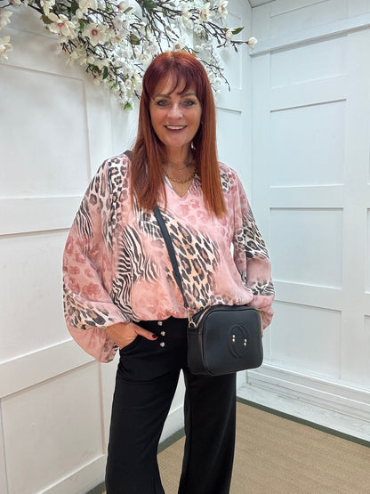 Vikki: Pink V neck animal print blouse. One size: 10-16