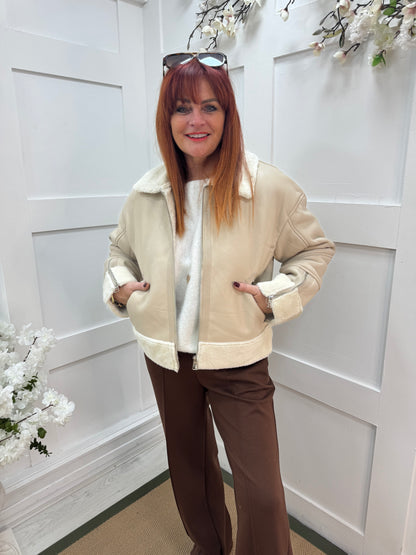 Fiora: Cream faux fur leather jacket. Two sizes