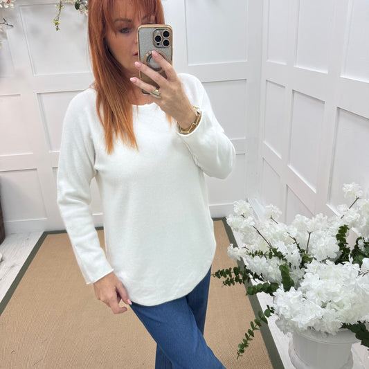 Mindy: White plain long sleeve knit top. One size: 10-16/18