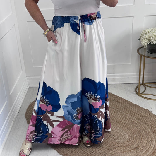 Becki: Blue silky floral palazzo trousers. One size: 8-16