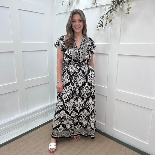 Charley: Black & white with gold fleck  V neck stretchy maxi dress. One size: 10-20
