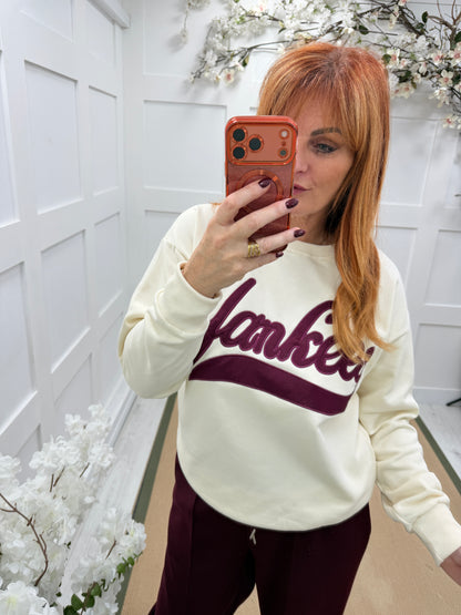 Yazmin: Cream & burgundy Yankee logo sweatshirt. One size: 12-16