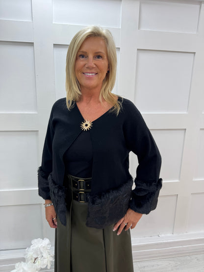 Pixi: Black faux fur & gold buckle coatigan. One size: 12-18