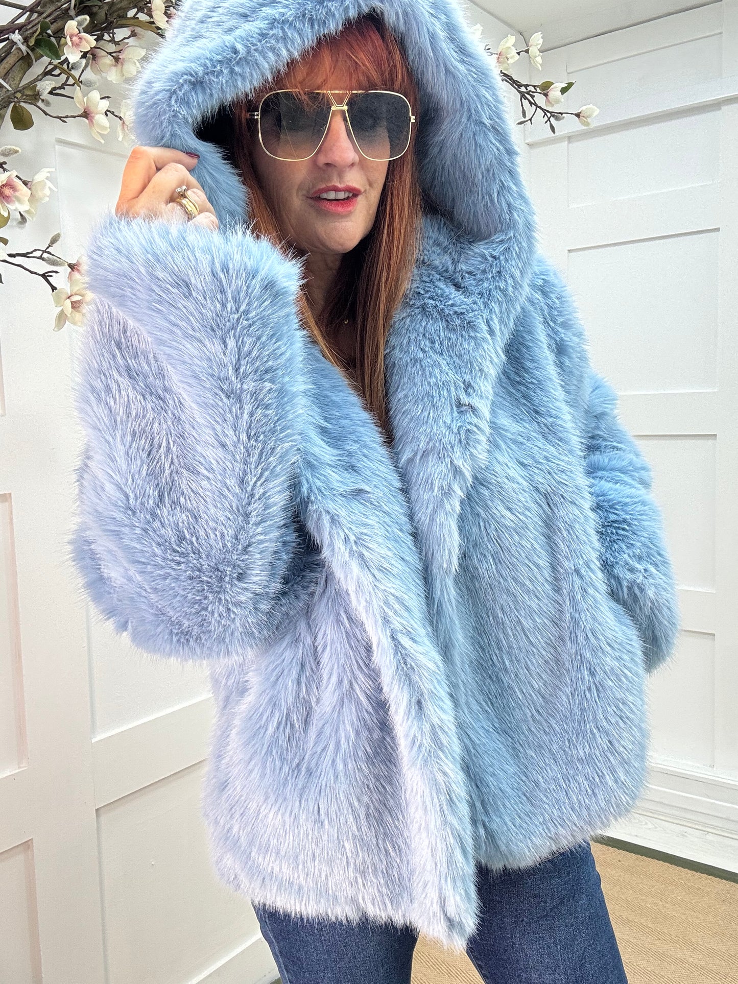 Foxy: Blue short faux fur hooded jacket. One size 12-16