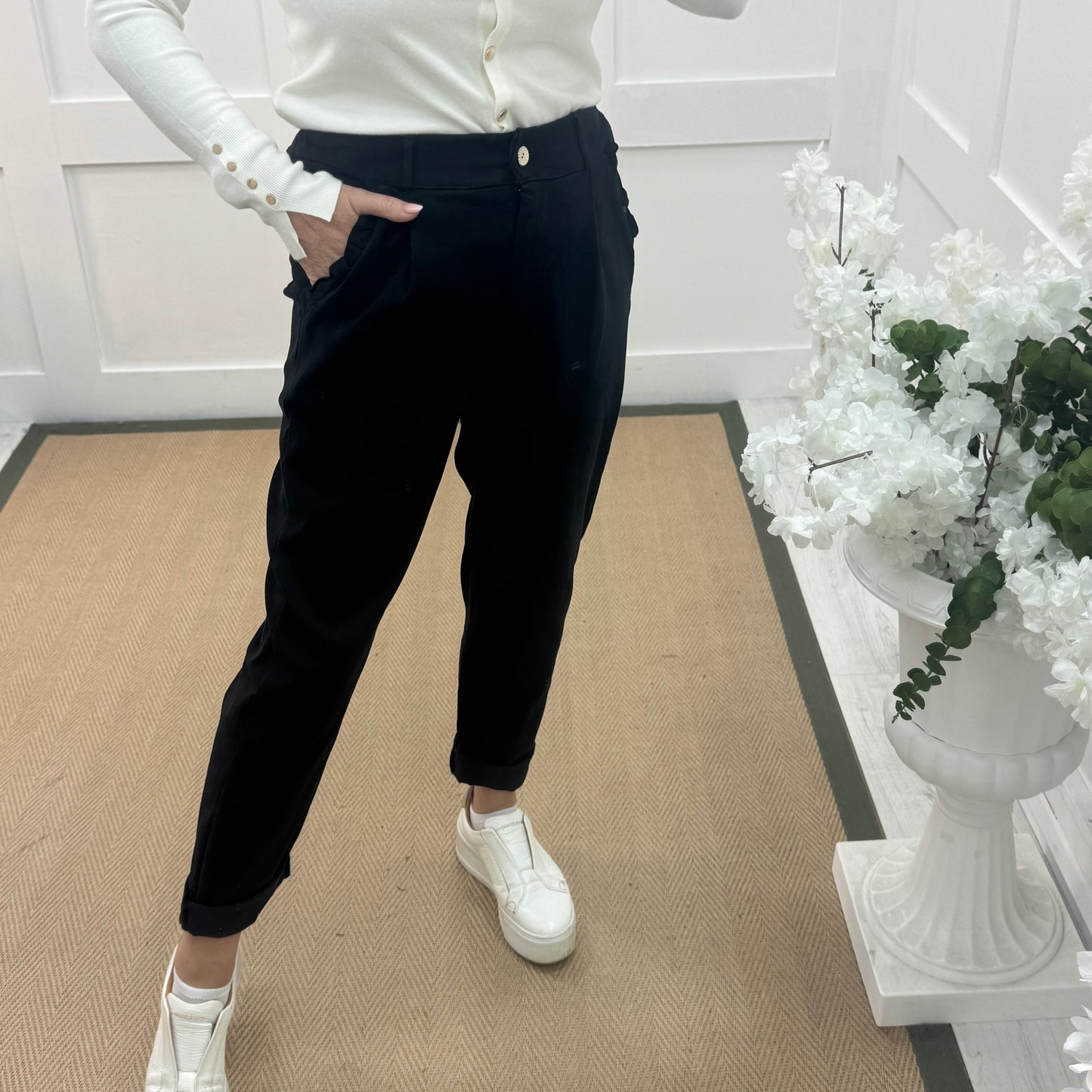 Mandi: Black stretchy frill pocket magic trousers with rear pockets. One Size: 14-20