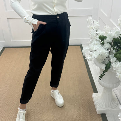 Mandi: Black stretchy frill pocket magic trousers with rear pockets. One Size: 14-20