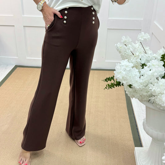 Paris: Brown stretchy gold button trousers. 4 sizes