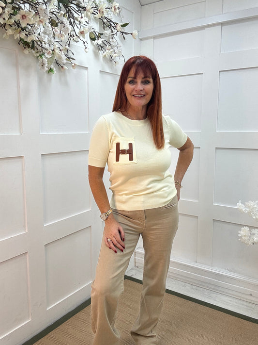 Harley: Lemon H logo knit top. One size: 8-14