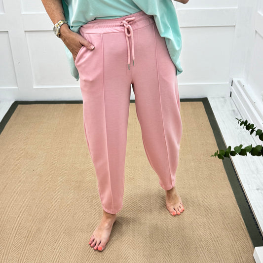 Bella: Pink stretchy barrel leg pocket trousers. One size: 8-16