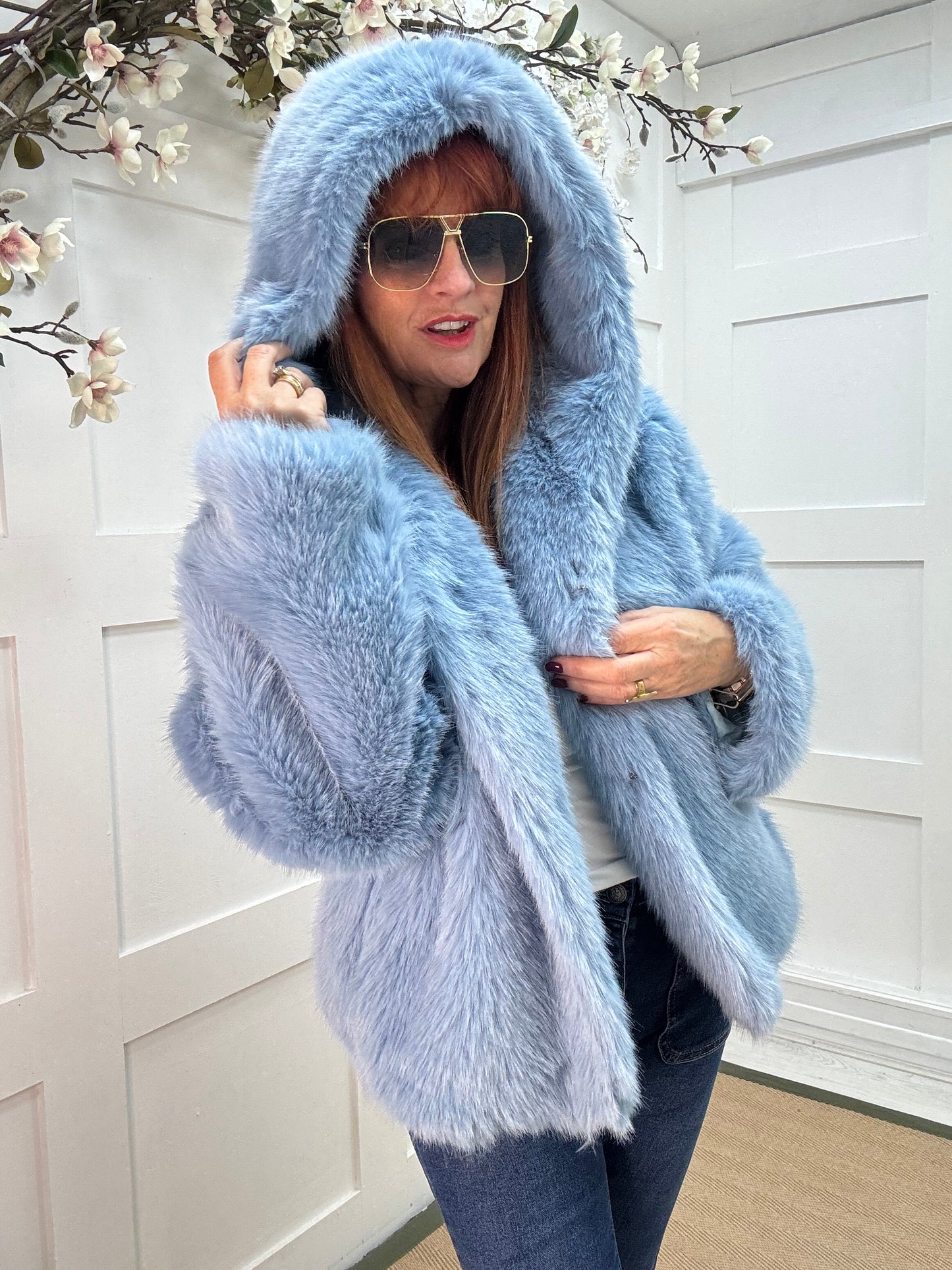 Foxy: Blue short faux fur hooded jacket. One size 12-16