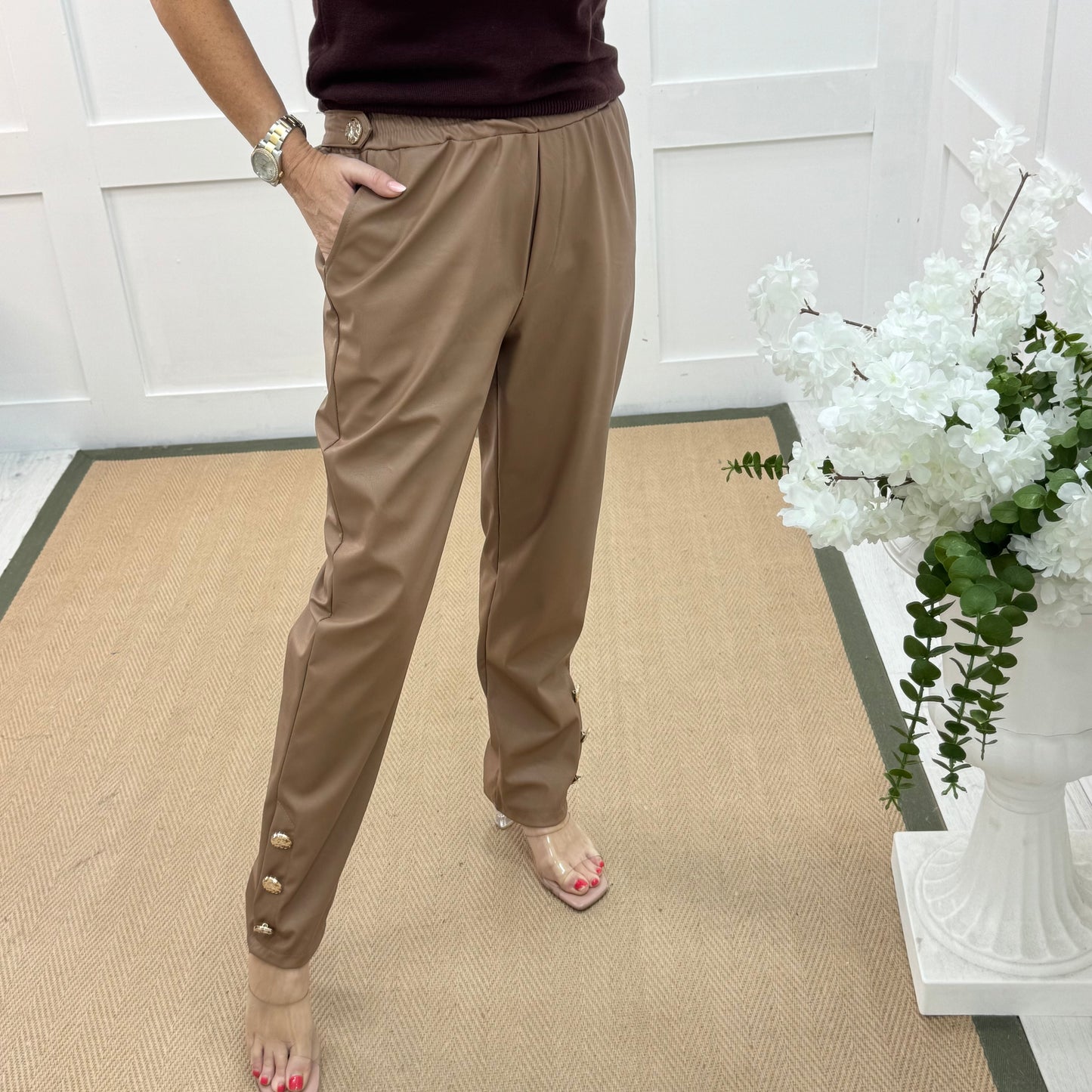 Tatum: Coffee faux leather button trousers. One size: 14-18