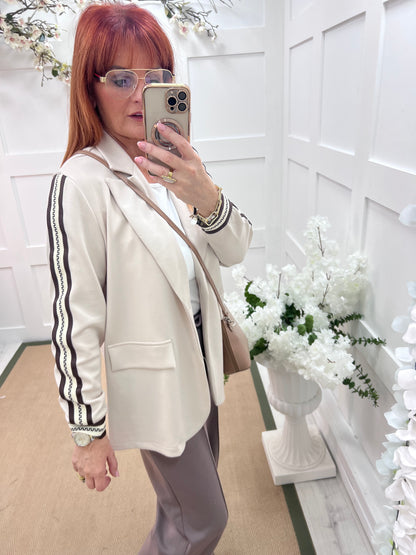 Ines: Cream sports stripe sleeve blazer. One size: 12-16