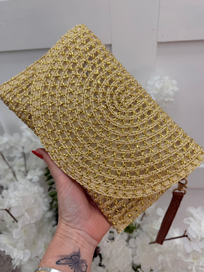 Solara: Gold raffia wristlet clutch bag