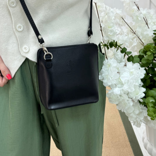 Thea: Black leather cross body/clutch bag.