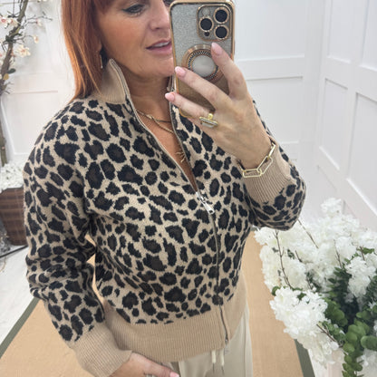 Ursula: Beige leopard print zipped neck top. One size: 12-18