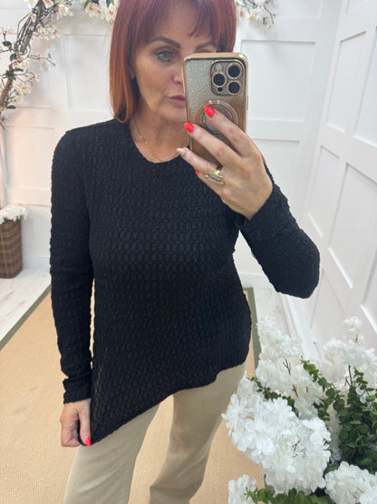 Lois: Black stretchy textured long sleeve top. One size: 12-20