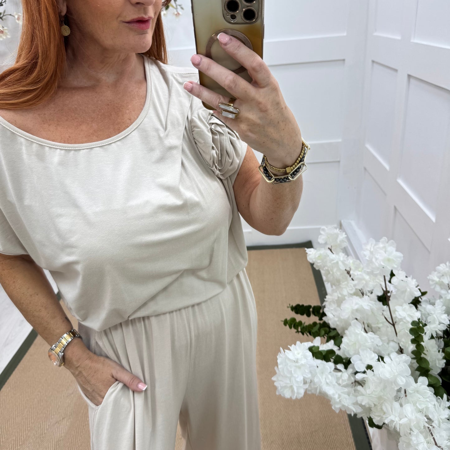 Rhianna: Cream jersey draped wide leg jumpsuit. One size: 10-16