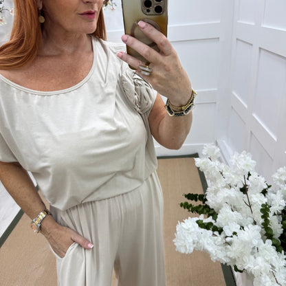 Rhianna: Cream jersey draped wide leg jumpsuit. One size: 10-16