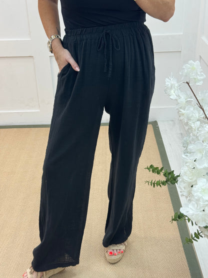 Tori: Black cotton wide leg trousers. One size: 8-16