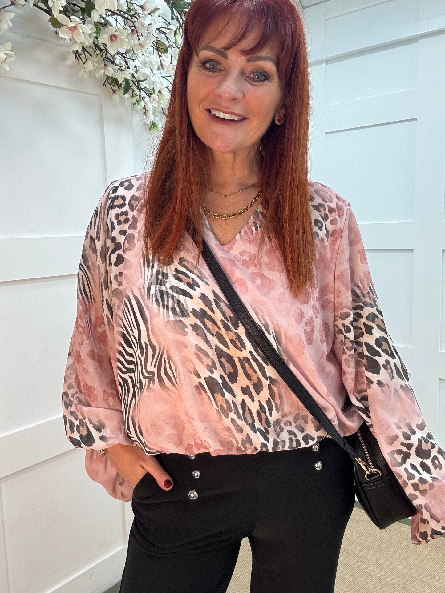 Vikki: Pink V neck animal print blouse. One size: 10-16