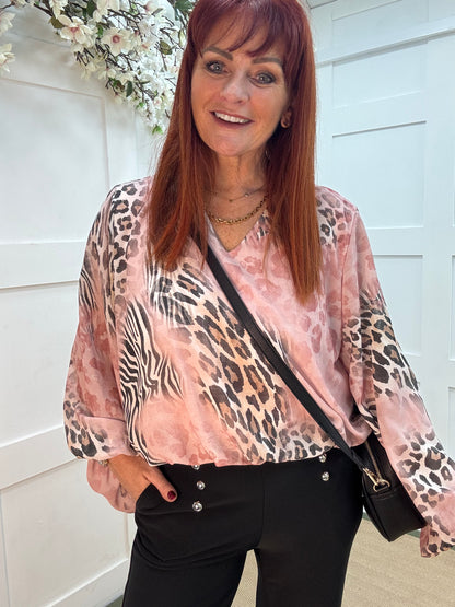 Vikki: Pink V neck animal print blouse. One size: 10-16