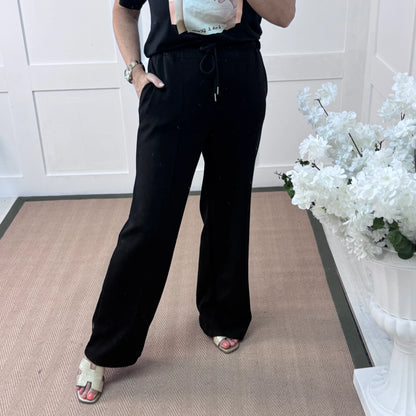 Trudy (Short): Black stretchy wide leg pocket trousers. One size: 10-16
