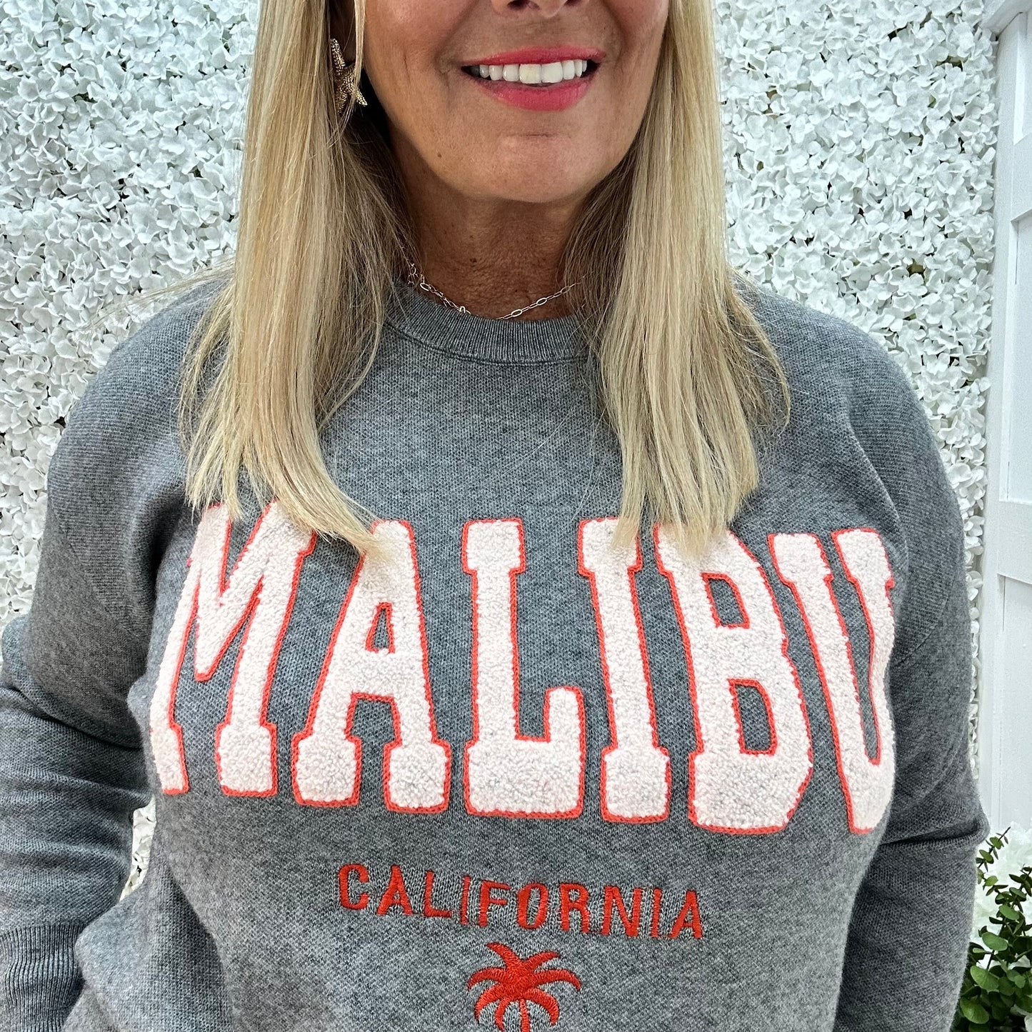 Melody: Grey textured MALIBU logo knitted top. One size 10-18