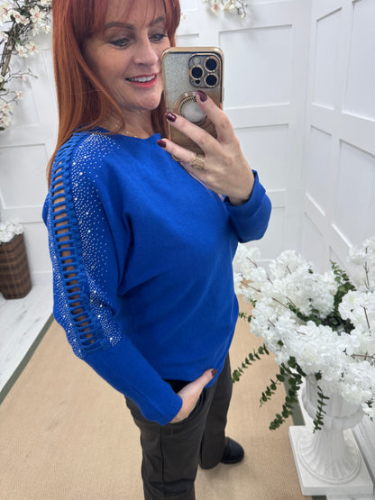 Arianne: Blue sparkle cutout shoulder top. One size: 12-16