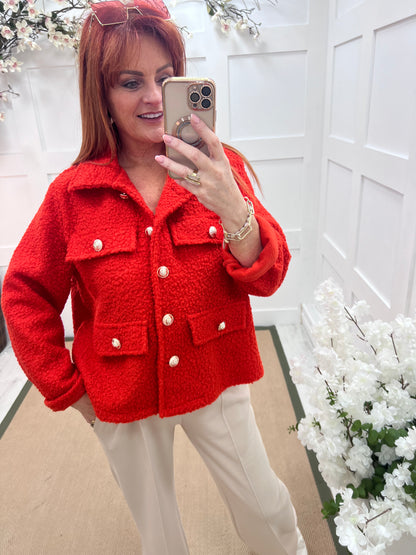 Bridget: Orange short boucle button jacket. One: 12-20