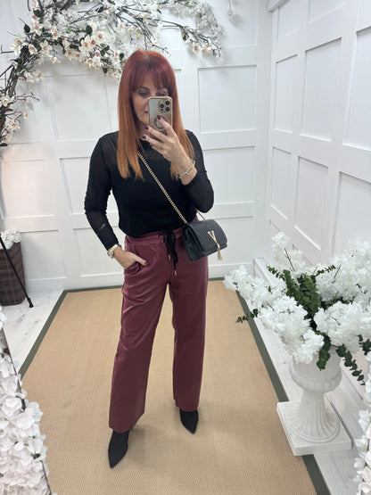 Romy: Black stretchy sheer mesh top. One size 12-18