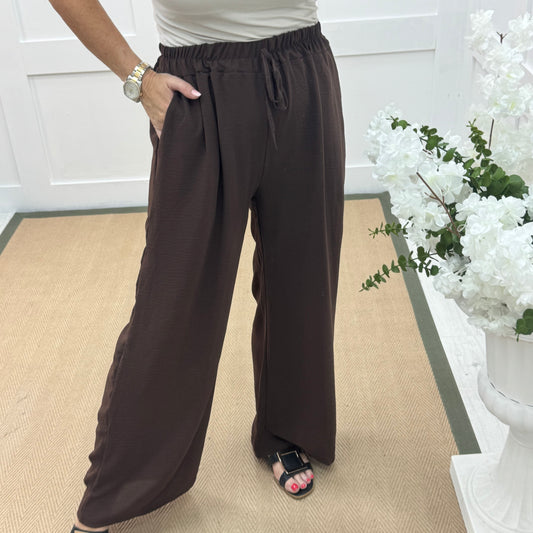 Esme: Brown pocket wide leg trousers. One size: 12-20